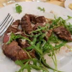 Tagliata di manzo con rucola e parmigiano Miramonti